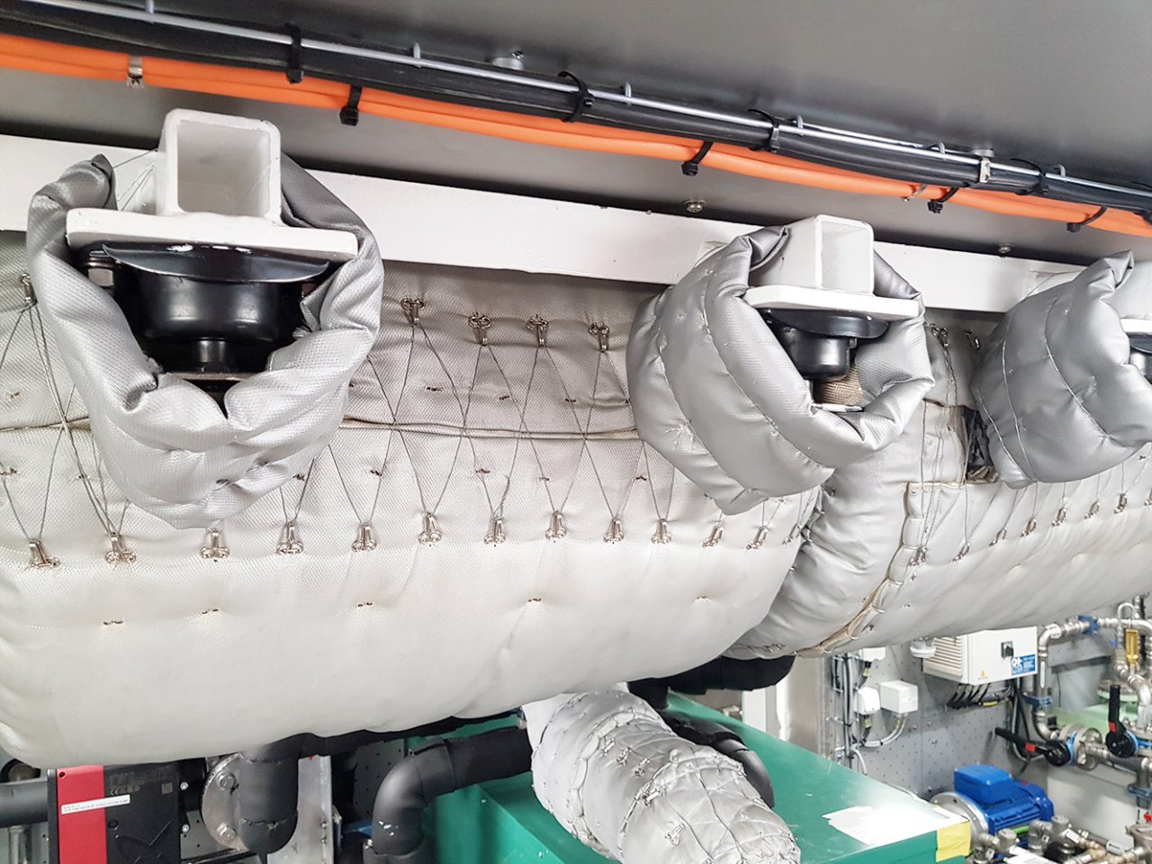 A marine engines exhaust suspended with VTCI-mounts to reduce vibrations, shock and noise