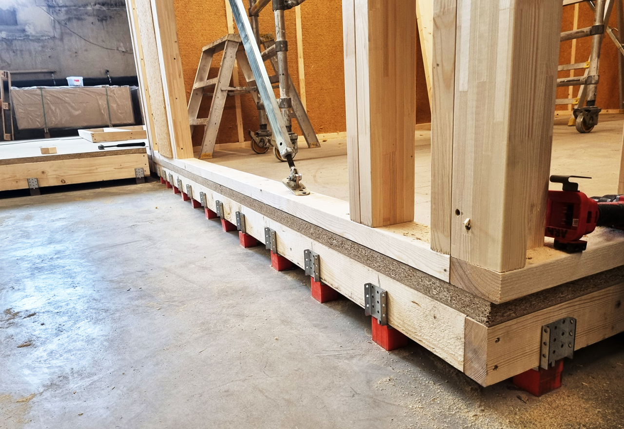 Image of Vibratecs flooting flor system flexible floor bracket under construction